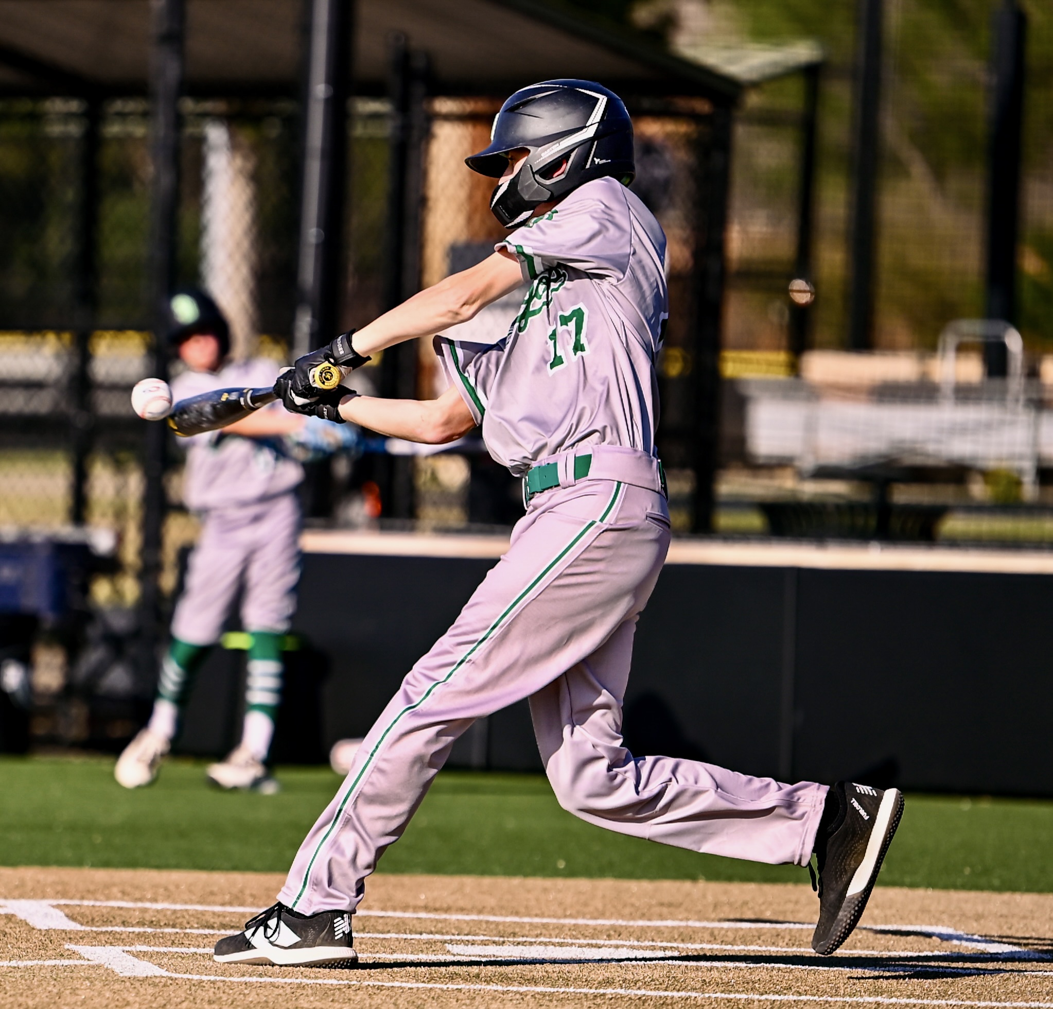 Youth baseball player swinging at the plate